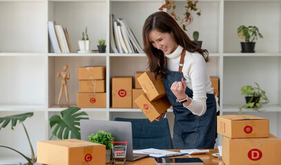  female entrepreneurs working on receipt box and check online orders to prepare to pack the boxes, sell to customers.