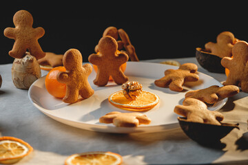 Christmas homemade gingerbread and colorful gifts on black background