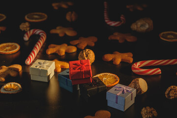 Christmas gifts with gingerbread isolated on a black background
