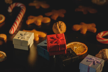 Christmas gifts with gingerbread isolated on a black background
