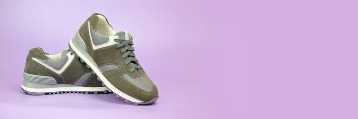 Sneakers for everyday use. Pair of unisex athletic boots with suede overlays and water-repellent...