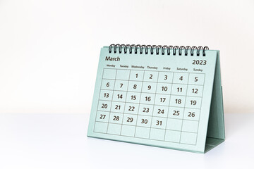 March 2023 calendar on white table. Month page