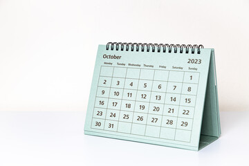 October 2023 calendar on white table. Month page