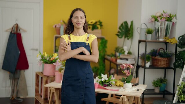 Young african american woman florist smiling confident standing with arms crossed gesture at flower shop