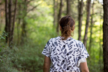 Girl walking through the woods