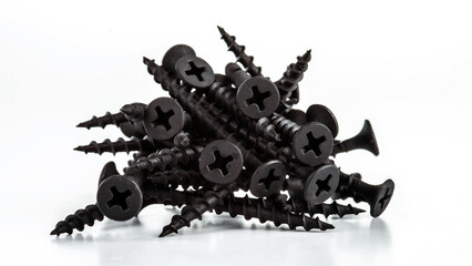 А bunch of screws for a cross-shaped screwdriver. Selective focus.