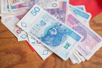 Polish money zloty banknotes on the Polish flag
