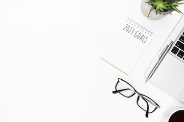 Notebook with 2023 goals text on it to apply new year resolutions and plan.