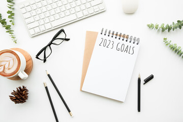 Notebook with 2023 goals text on it to apply new year resolutions and plan.