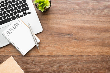 Notebook with 2023 goals text on it to apply new year resolutions and plan.