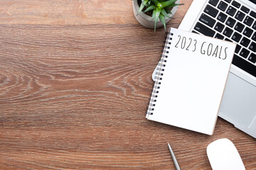 Notebook with 2023 goals text on it to apply new year resolutions and plan.