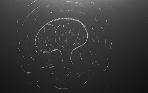 overthinking concept. thinking brain drawn on chalkboard.