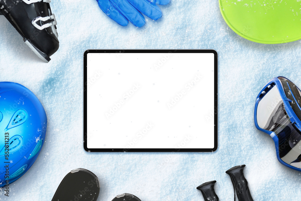 Poster tablet with isolated transparent display for copy or web page presentation on snow surrounded by ski