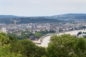 Fototapeta premium Panorama View of Koblenz with Deutsches Eck (German Corner) between Rhine and Moselle river and Emperor William monument statue, Germany
