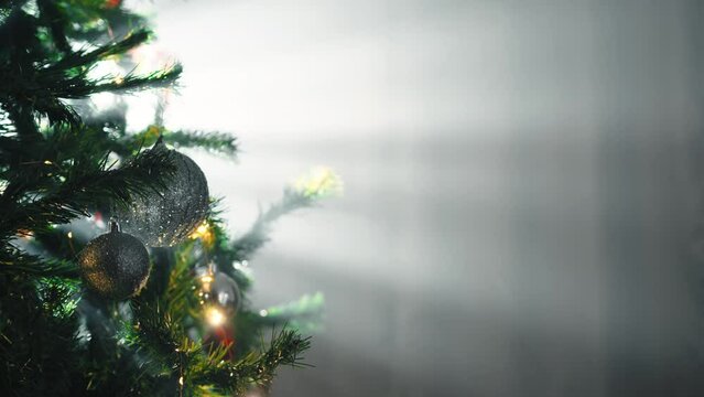 Lights shine over the Christmas tree in the house