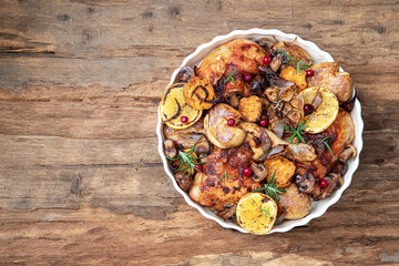 Roast chicken thighs with orange ,vegetables, mushrooms, chestnuts  and rosemary