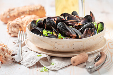 Homemade and tasty mussels with chili peppers and coriander.