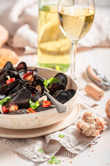 Homemade and tasty mussels served with white wine.