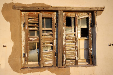Shutters on the window of an abandoned farmhouse in Bushmanland, South Africa