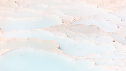 Emerald water in white limestone rock.