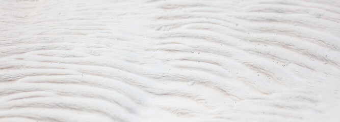 White volcanic limestone rock as background.