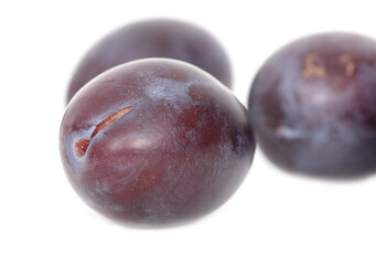 Ripe plum berries isolated on white background.