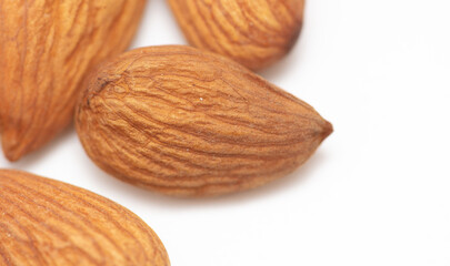 Almond nuts isolated on white background.