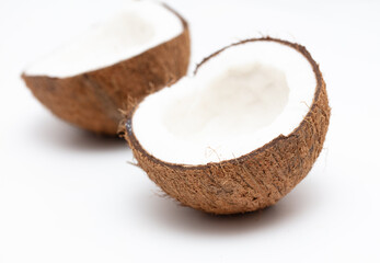 Cracked coconut nut isolated on white background.