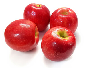 Red apples. Ripe fruit with natural shadow on a white background
