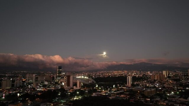 Sunset Aerial view of La Sabana Park and Costa Rica National Stadium with San Jose, Costa Rica in the background