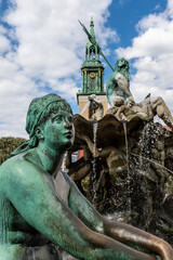 The Neptune Fountain (German: Neptunbrunnen) and St. Mary's Church, known in German as the...