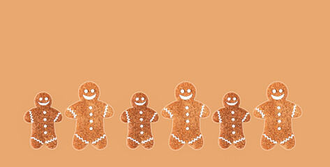 Group of christmas gingerbread men on brown background