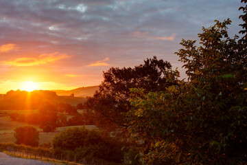 Top view of the french hills on the cloudy sky at sunrise