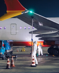 passenger jet in the airport being cleaned