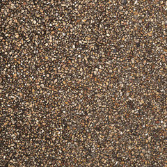 The pattern small brown pebbles stone as background. pebbles texture wall and floor.