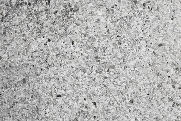 The pattern small grey pebbles stone as background. pebbles texture wall and floor.