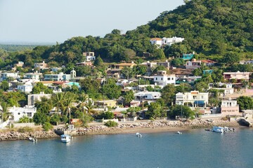 The distance view of the resorts, boats and buildings on the bay near Mazatlan, Mexico