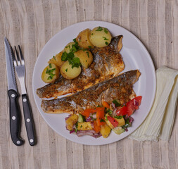 Sea bass with pineapple salsa and new potatoes.