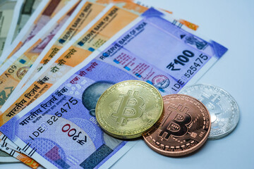 Bitcoins and Indian currency bank notes,