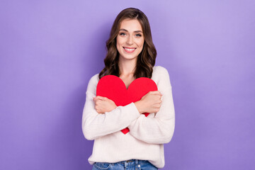 Photo of adorable pretty lady girlfriend hold red heart rejoice present romantic gift fell in love isolated on purple color background