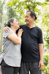 Obraz premium lovely old wife hugging her senior husband with togetherness skinship, concept image of old age couple, family relationship, long lasting marriage life