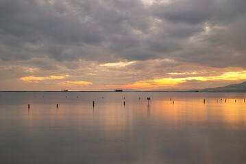 Dreamlike landscapes in the calm waters of the Ebro Delta at sunset.