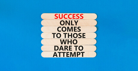 Success symbol. Concept words Success only comes to those who dare to attempt on wooden sticks. Beautiful blue table blue background copy space. Business success and attempt concept. - obrazy, fototapety, plakaty