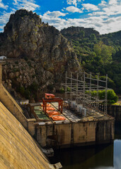 Electrical substation with bridge crane in waterfall