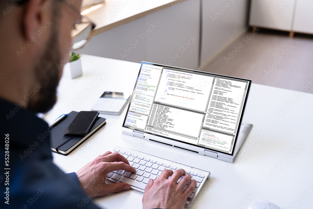 Poster Programmer Or Coder At Office Desk