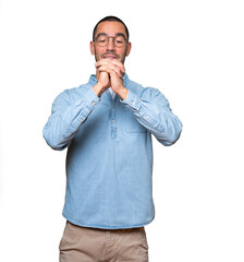 Young man making a gesture of team work with his hands