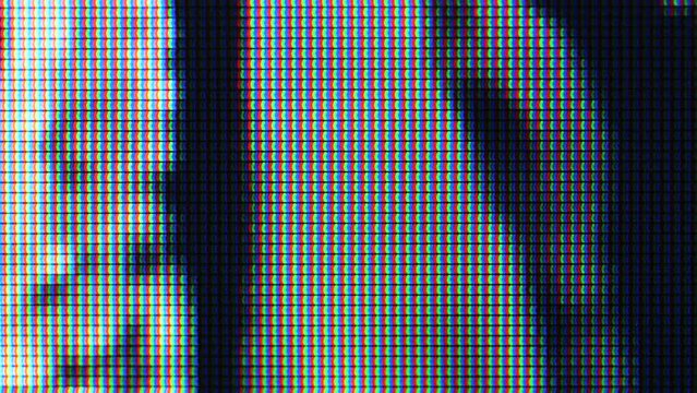 Abstract spooky creepy TV screen, pictures moving, black and white images on color display, animation. Moving background texture, motion, macro, details, extreme closeup, pixels visible, nobody.