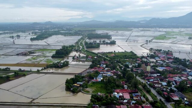 Aerial view Kubang Semang town beside paddy field water season