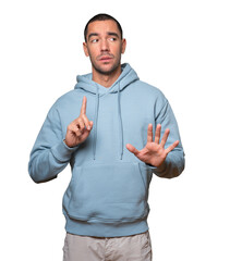 Haughty young man making a contemptuous gesture