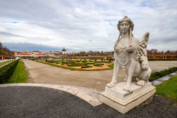 Fototapeta na wymiar Cityscape with the garden of Schloss Belvedere in Vienna and its statue. Belvedere Castle during the Christmas holidays.